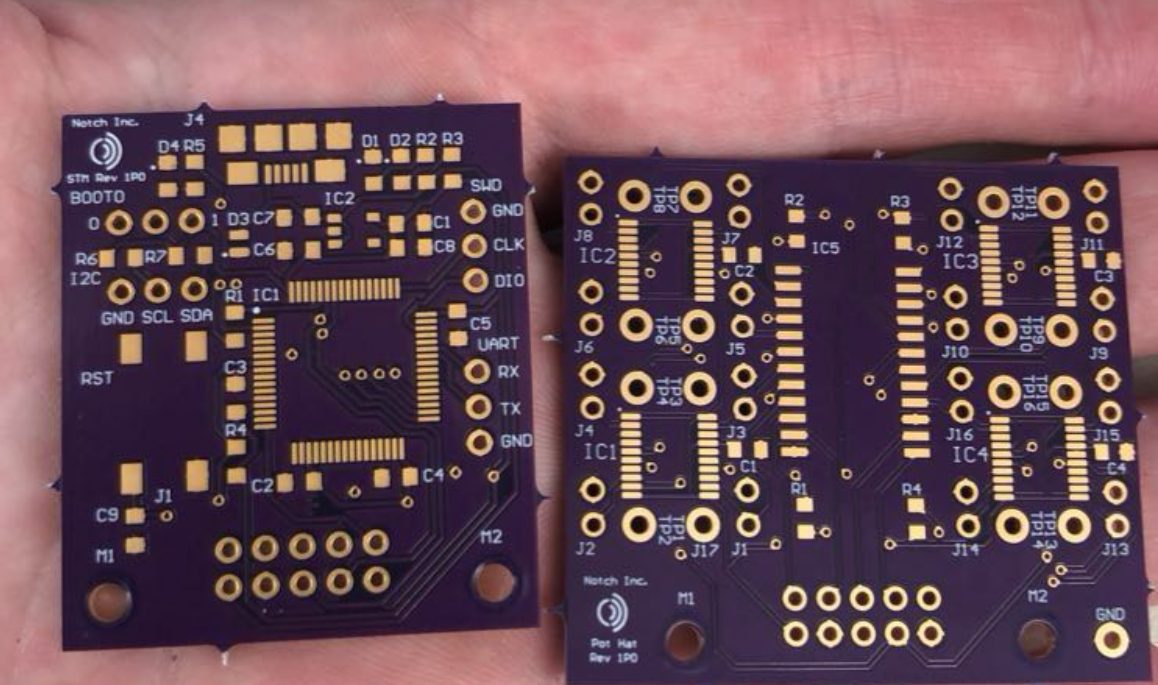 Two purple PCB assemblies side by side, showing component placement and silkscreen labeling